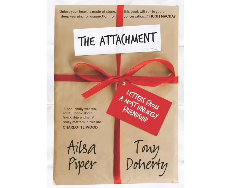 A book cover featuring a rectangular object wrapped in brown paper, tied with a red ribbon, and overlaid with a white label that reads The Attachment