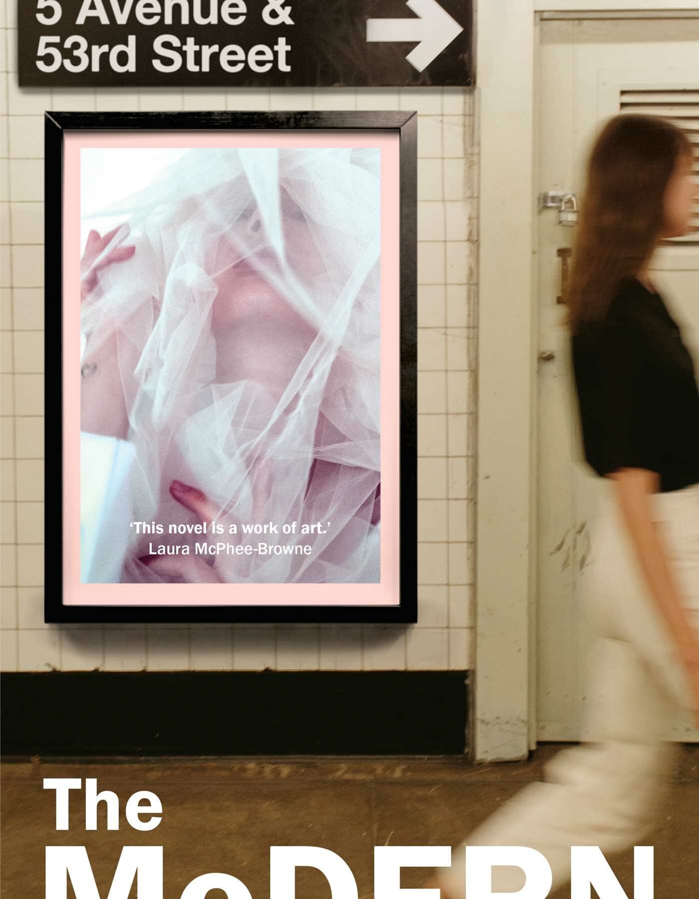 A book cover featuring a blurry photograph of a woman in a train station walking past a poster with white and pink abstract art